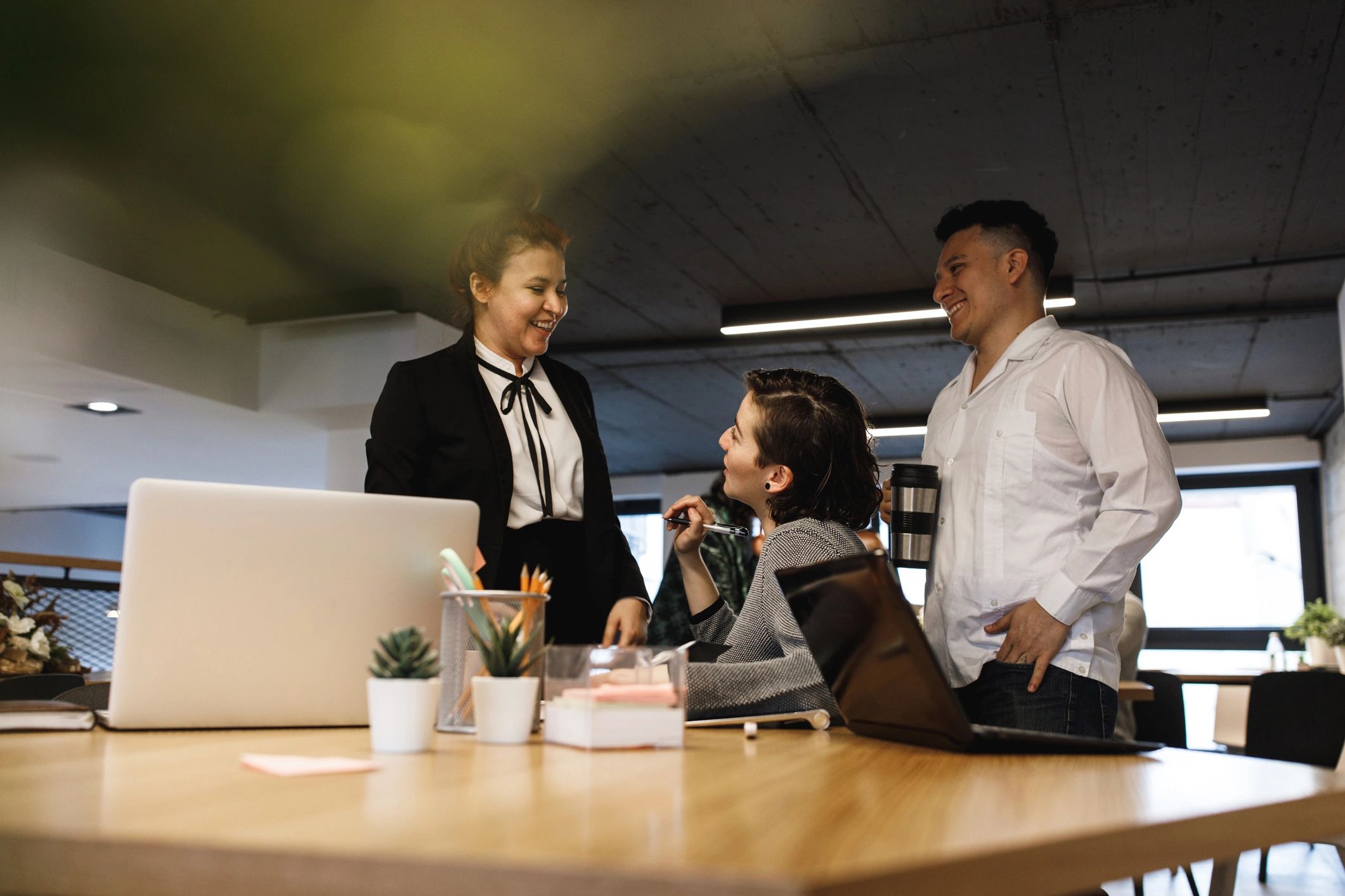 Office team talking together after a meeting