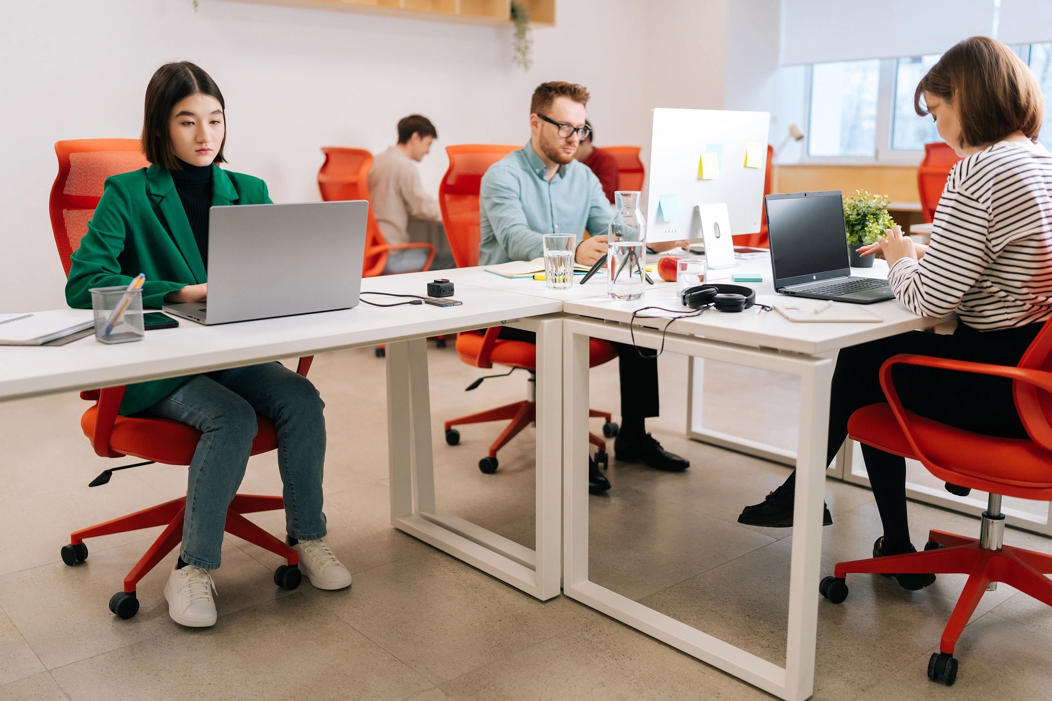 Startup team working together around a laptop